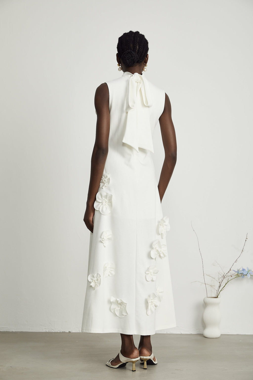 Magali White Sleeveless Maxi Dress with Faux Flower & Bow-Tie Embellishment