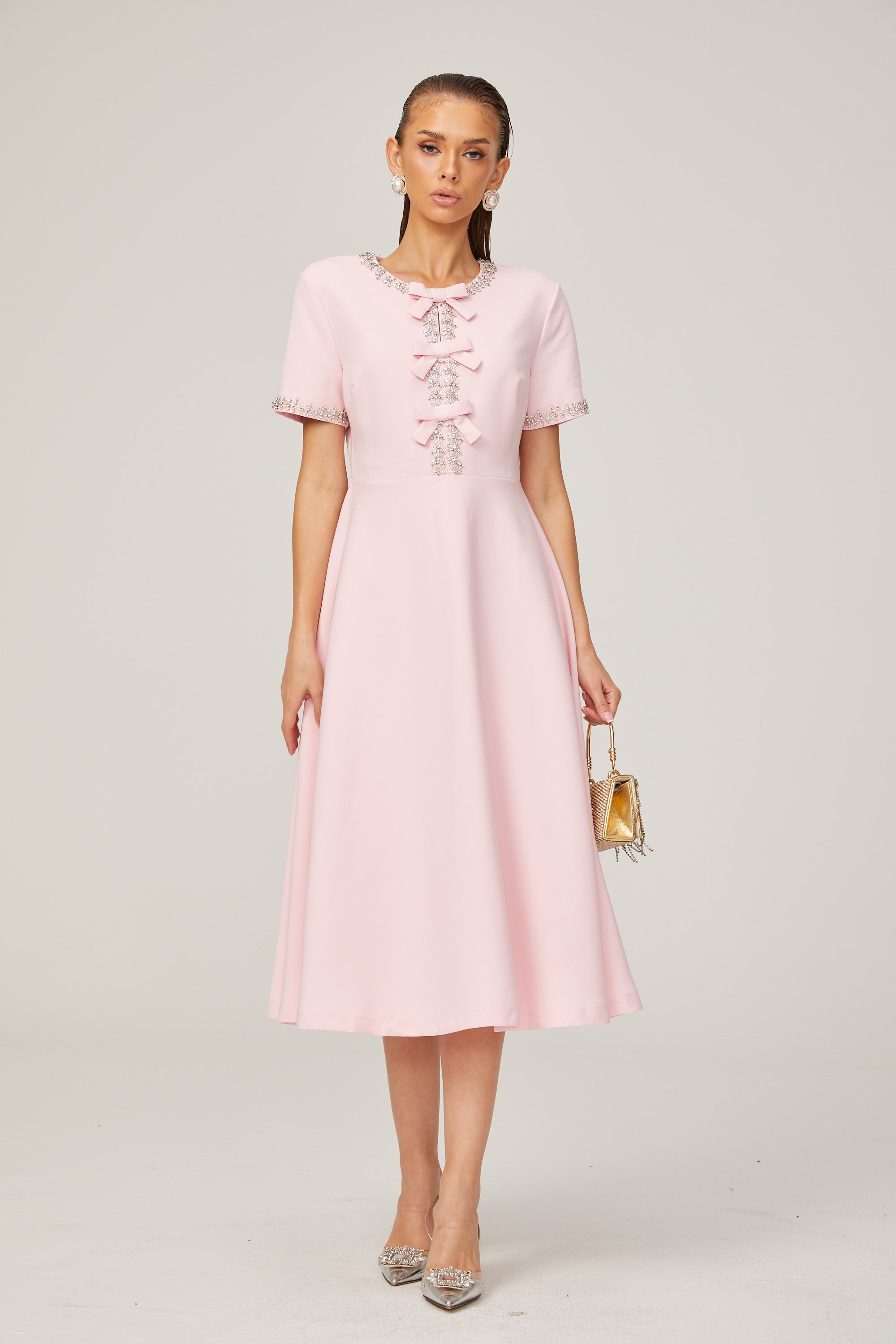 Cassiopeia crystal-accented pink bow midi dress