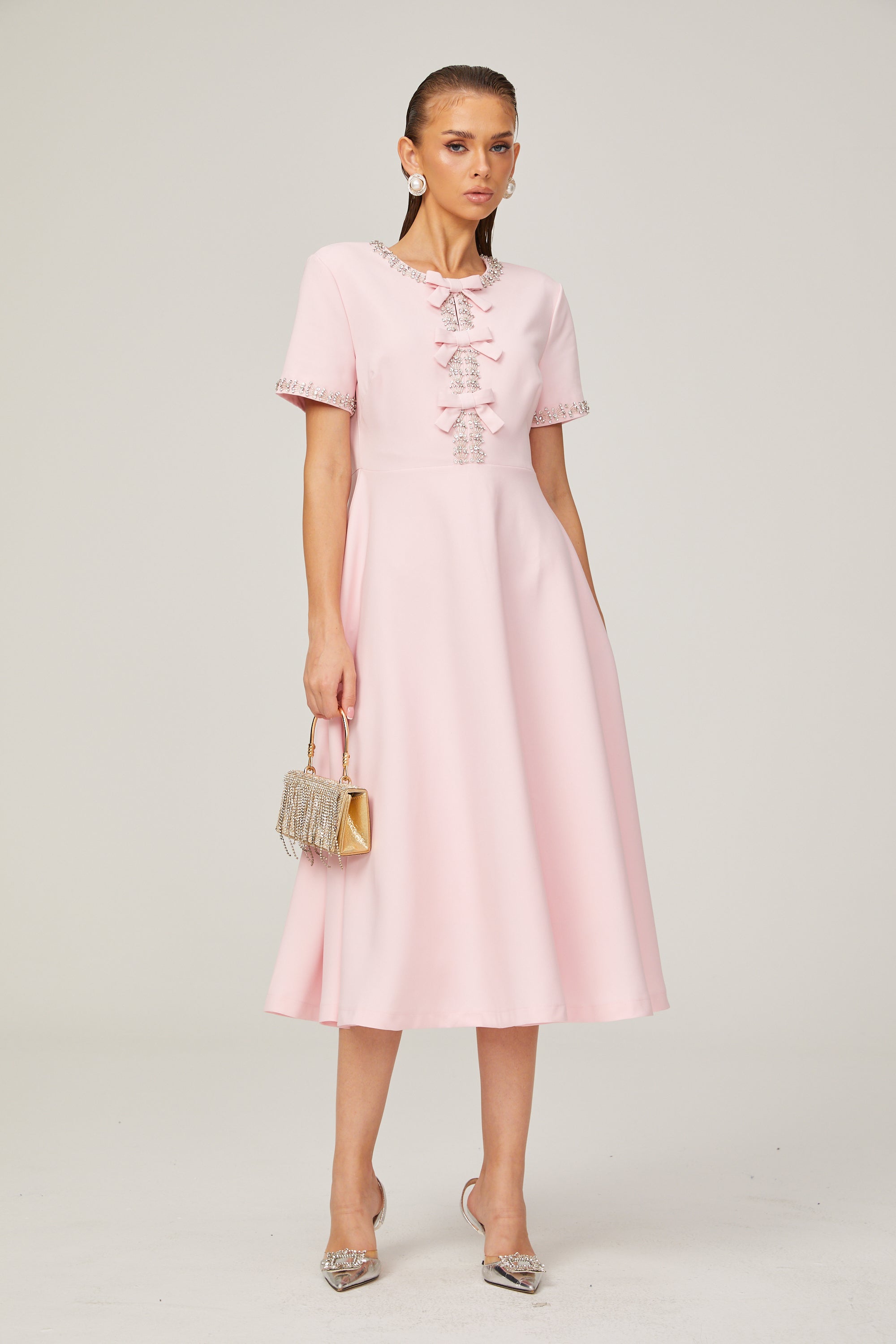 Cassiopeia crystal-accented pink bow midi dress