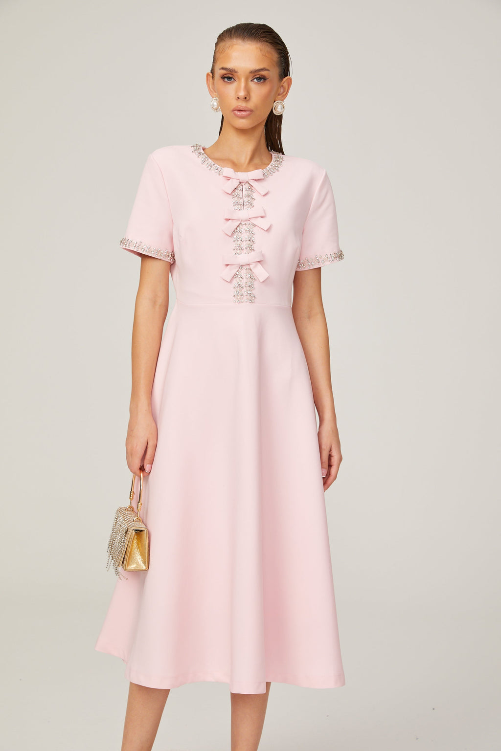 Cassiopeia crystal-accented pink bow midi dress