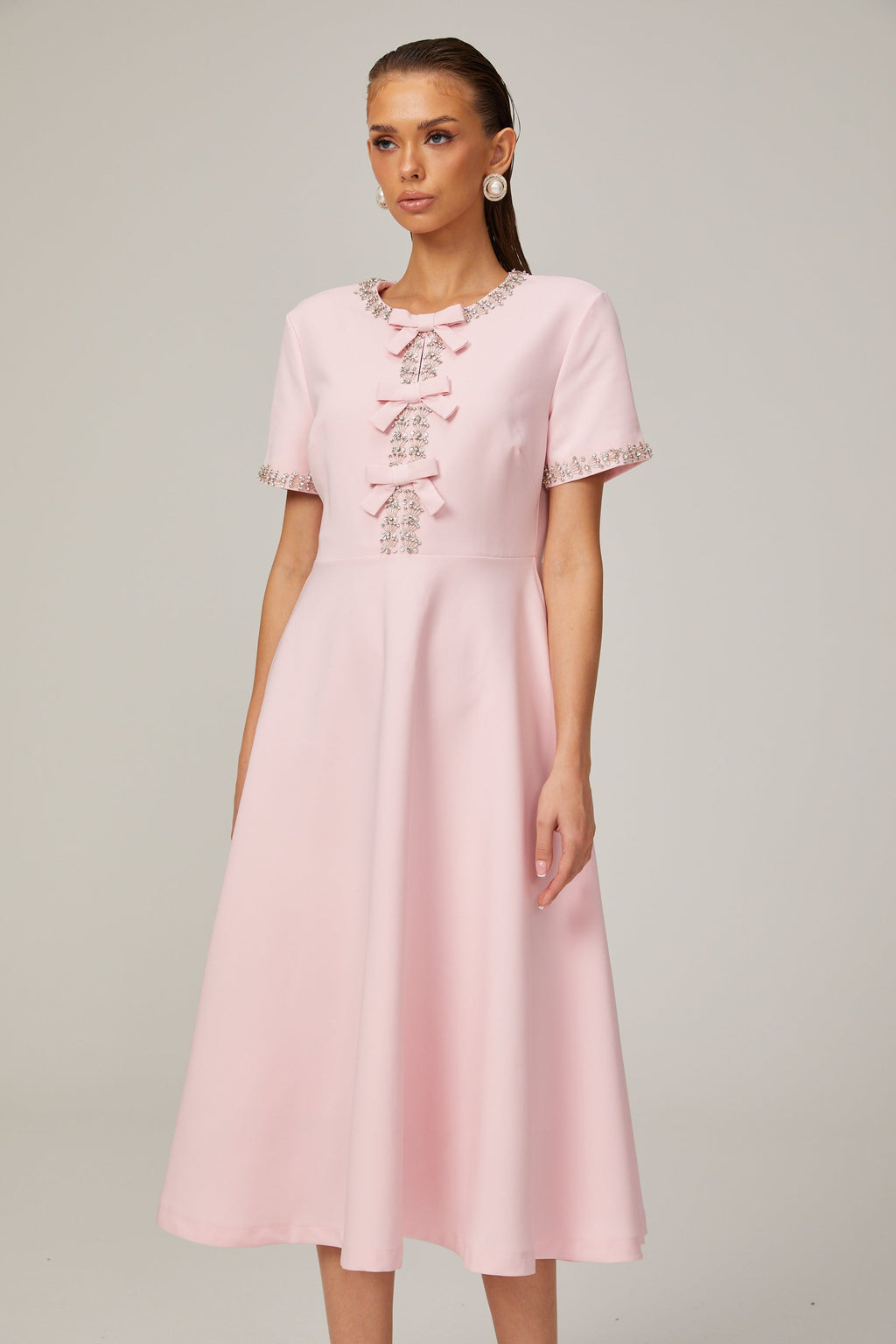 Cassiopeia crystal-accented pink bow midi dress