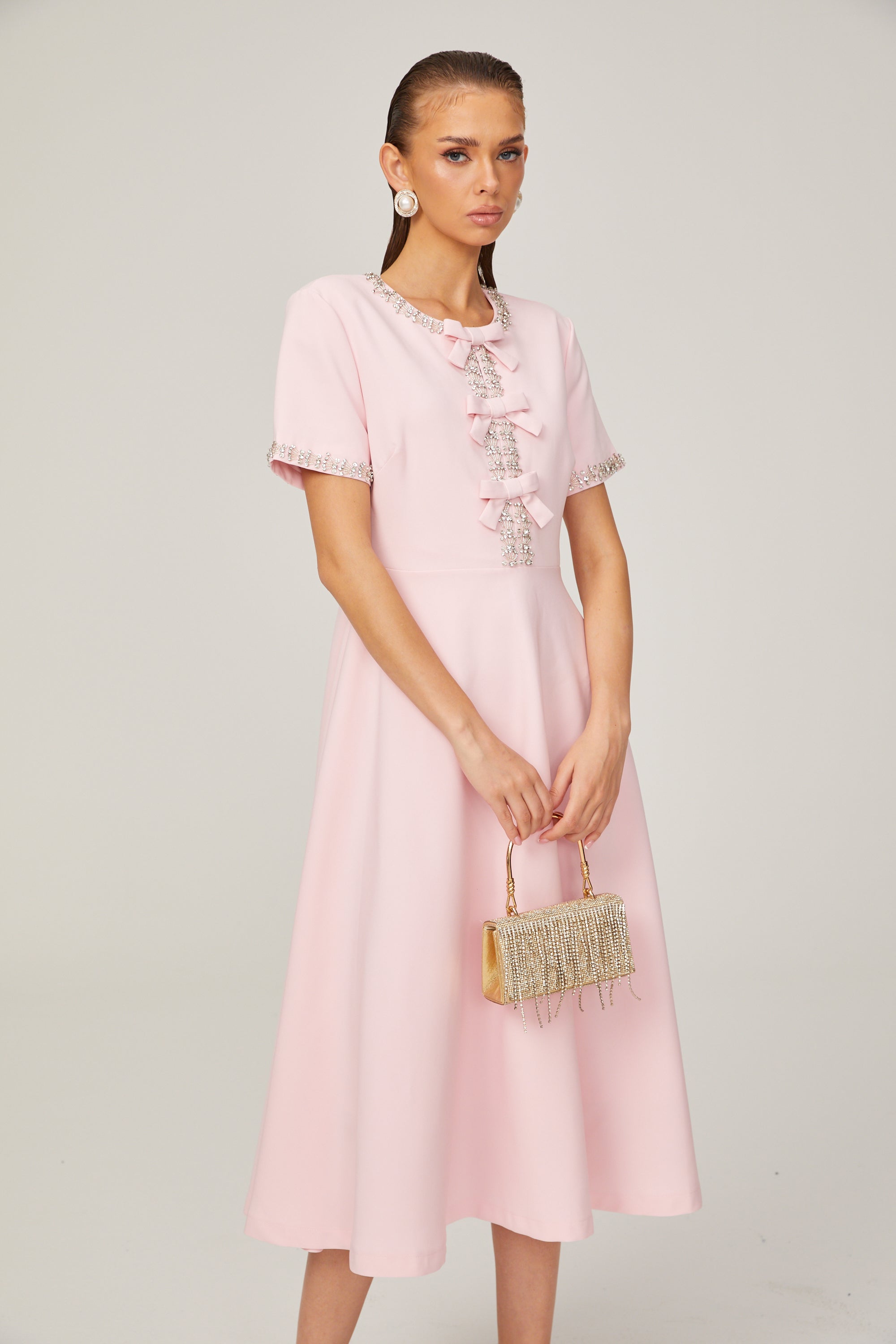 Cassiopeia crystal-accented pink bow midi dress