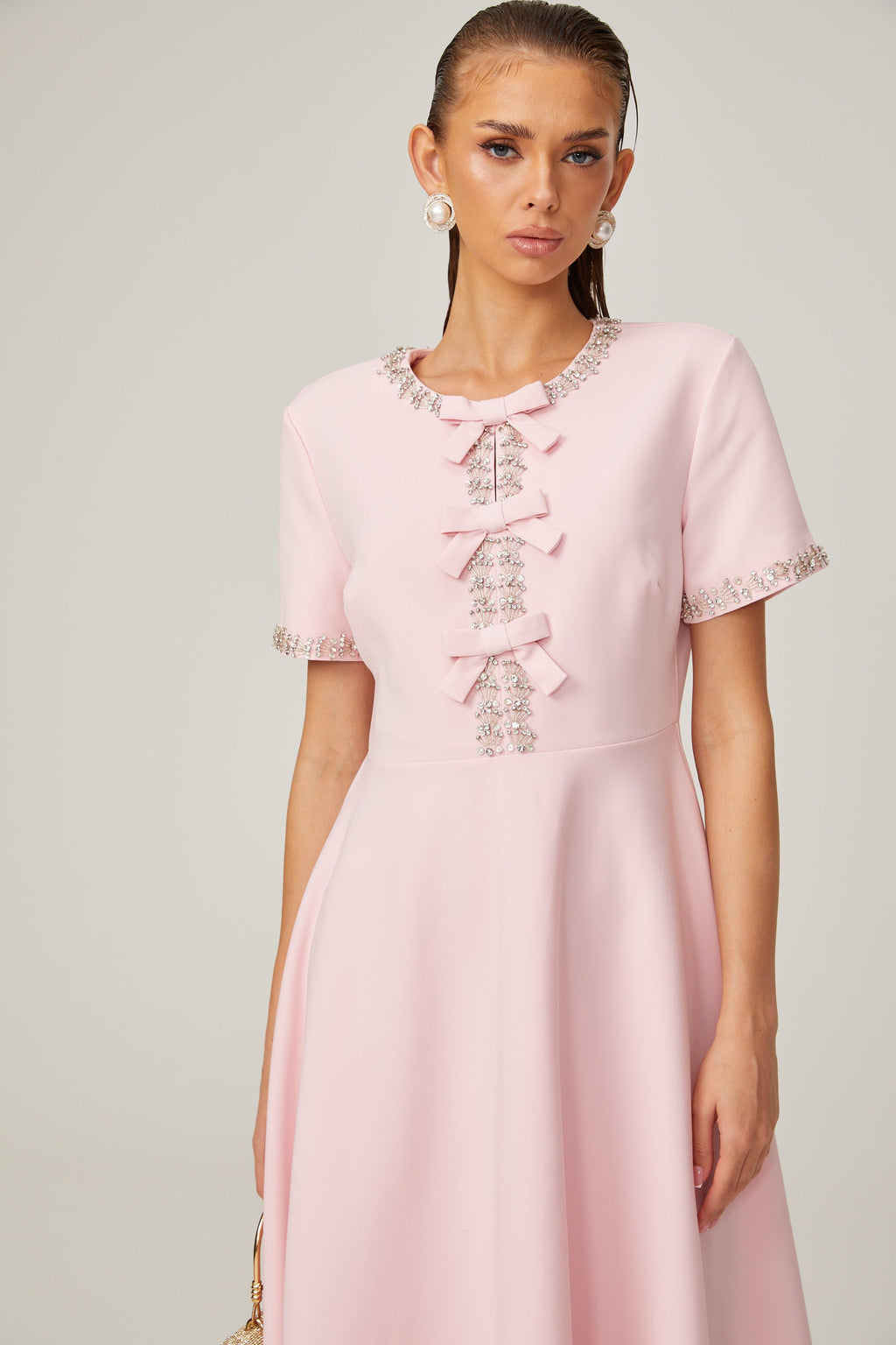 Cassiopeia crystal-accented pink bow midi dress