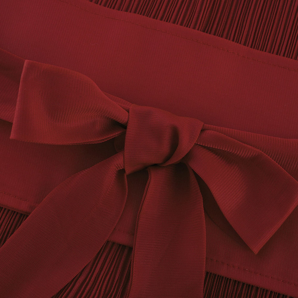 Margaux matchande set med plisserad topp och kjol med fluga