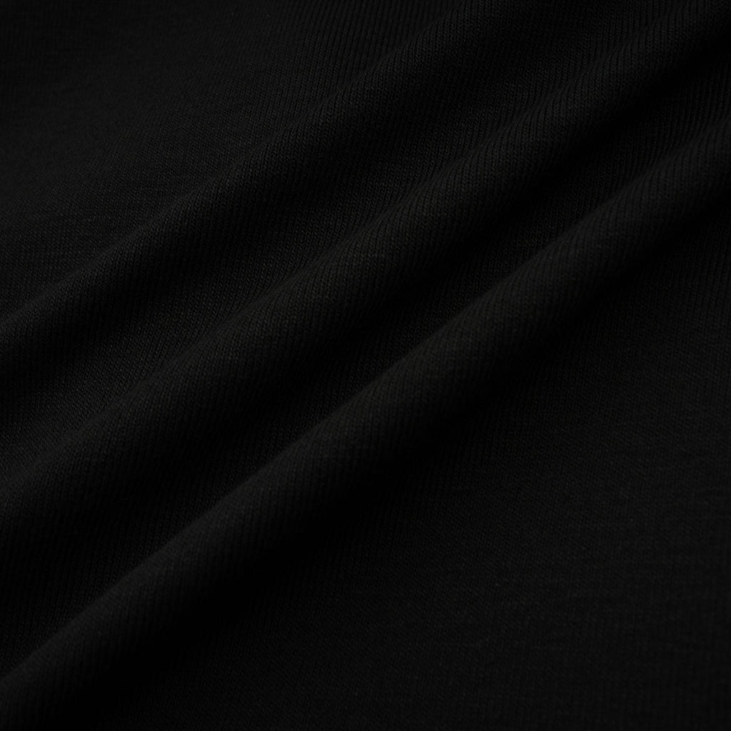 Anaïs svart topp med öppen framsida och rynkad passform