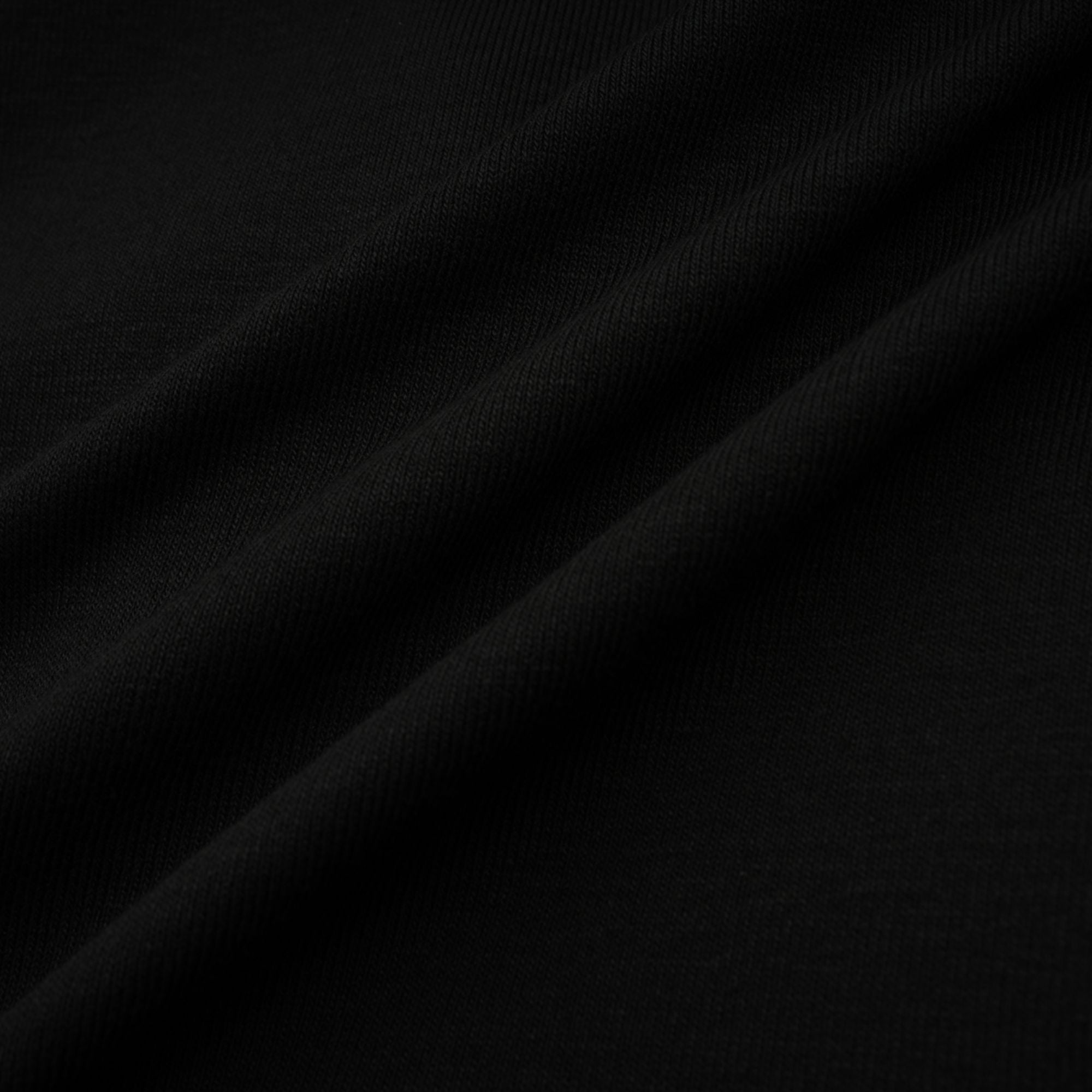 Anaïs svart topp med öppen framsida och rynkad passform