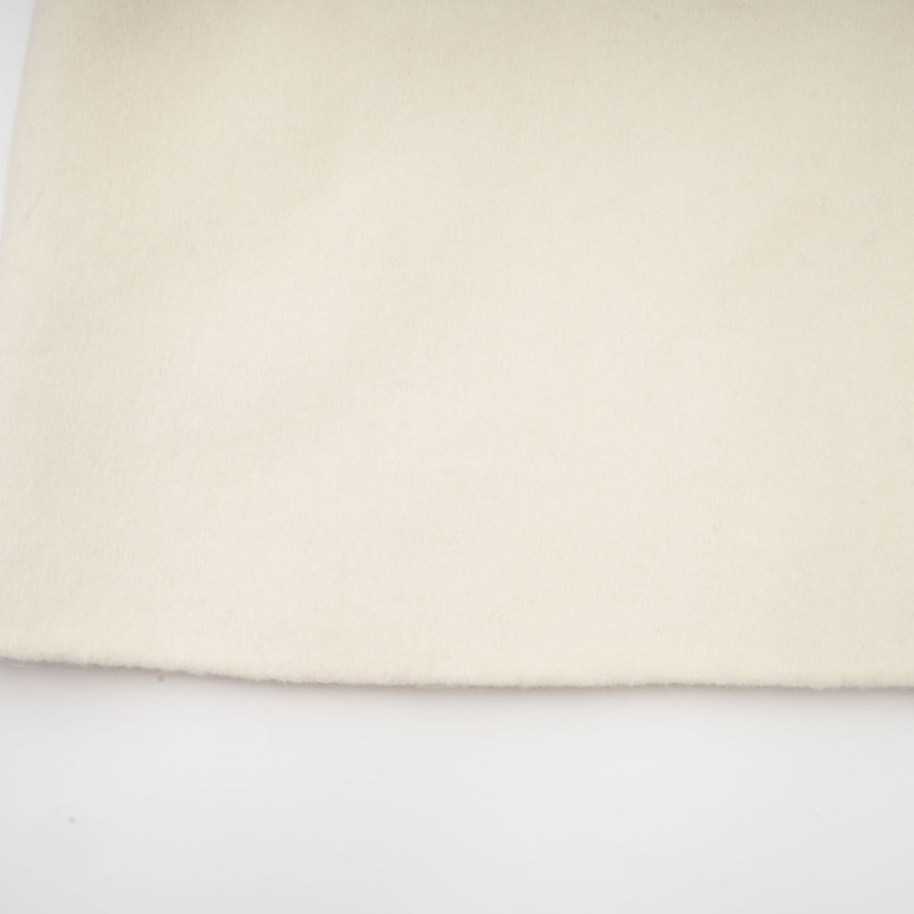 Colette vit ullpälskappa med rosett