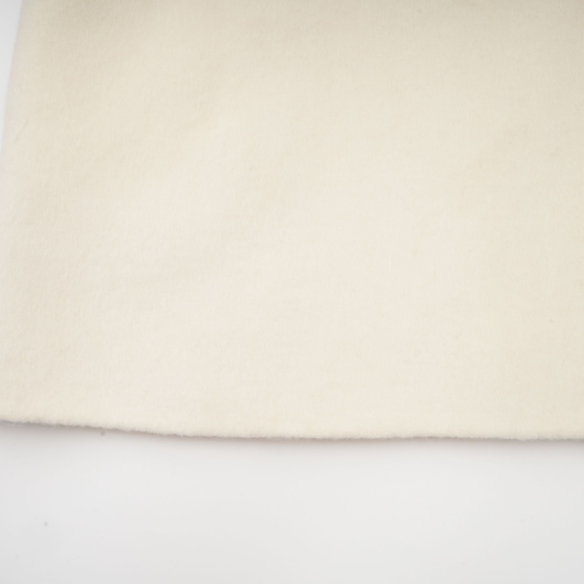 Colette vit ullpälskappa med rosett