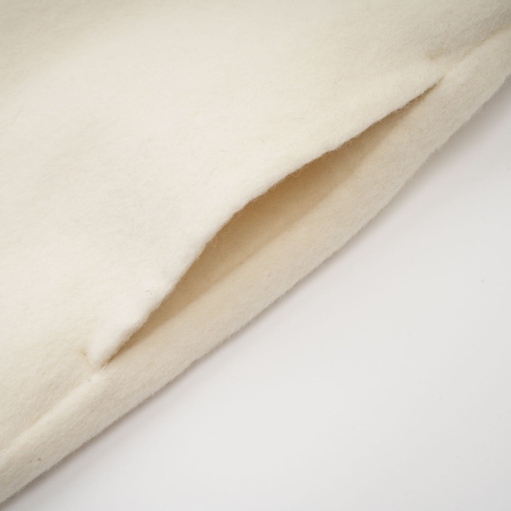 Colette vit ullpälskappa med rosett