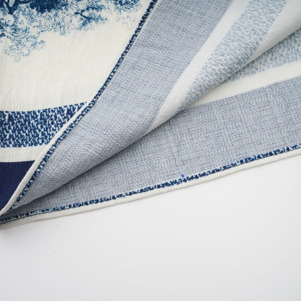 Adélaïde midiklänning med grafiskt tryck i blå 