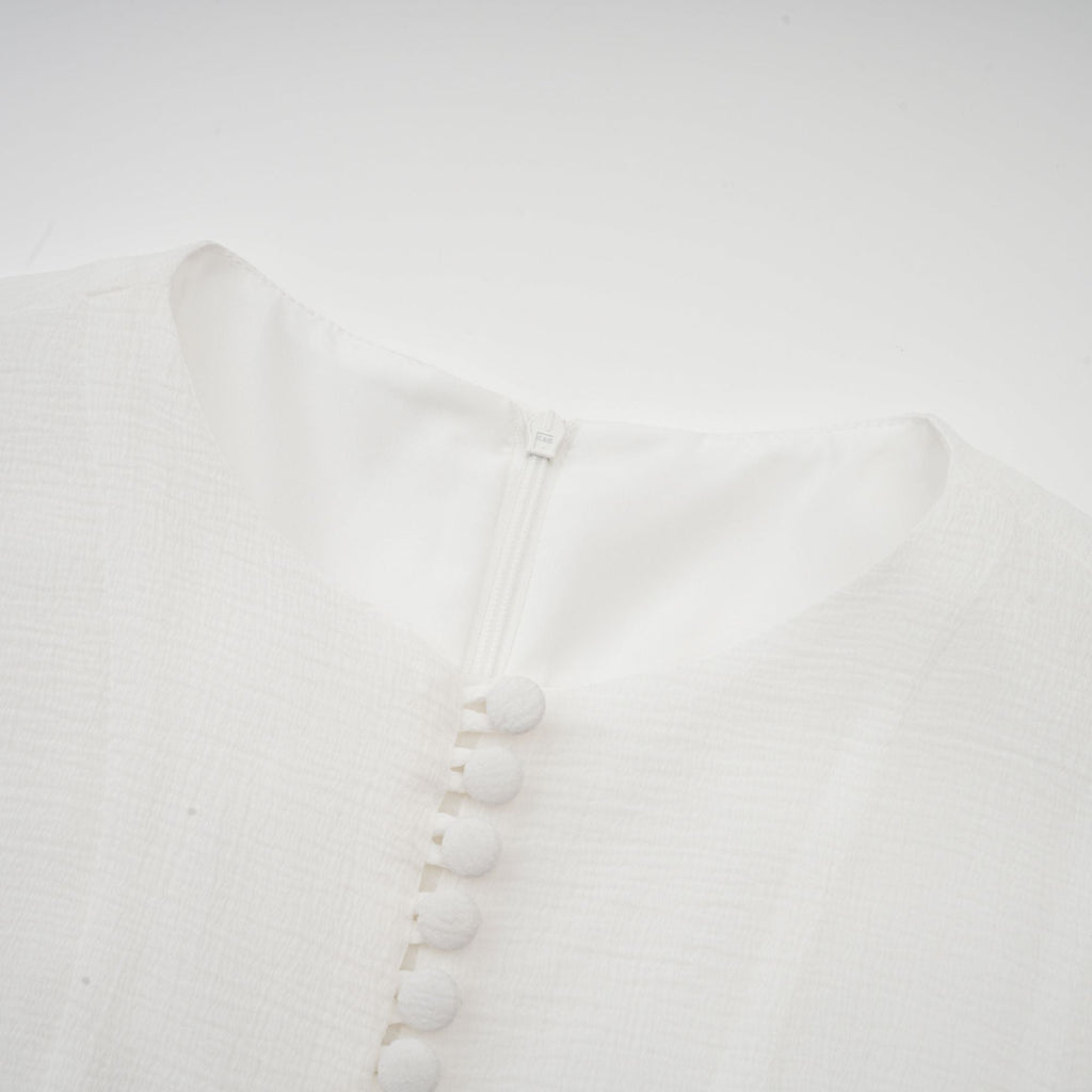 Anaïs halvtransparent utsvängd miniklänning