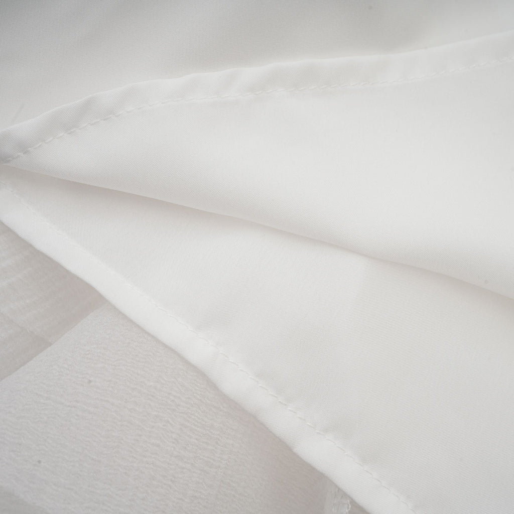 Anaïs halvtransparent utsvängd miniklänning