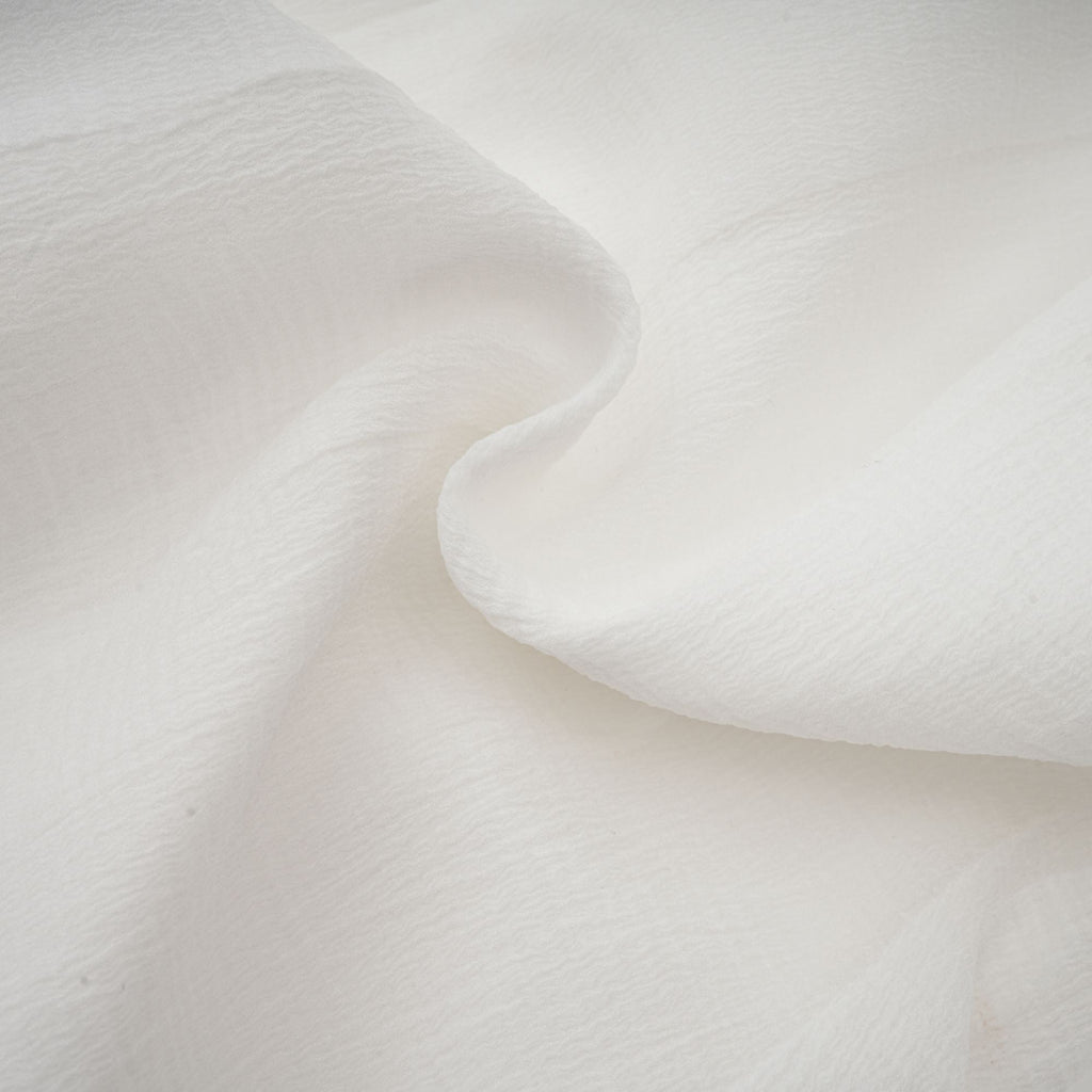 Anaïs halvtransparent utsvängd miniklänning