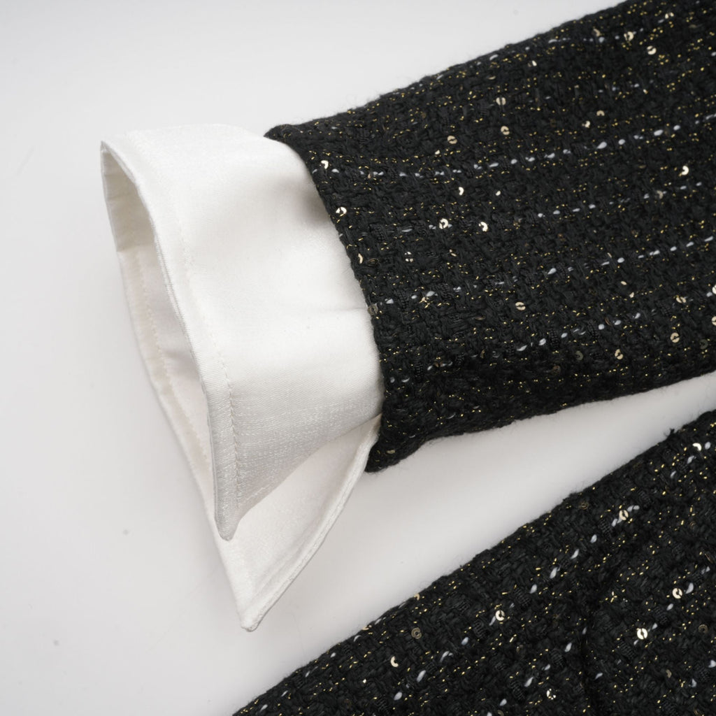 Audrey svart tweed miniklänning med paljettpaneler