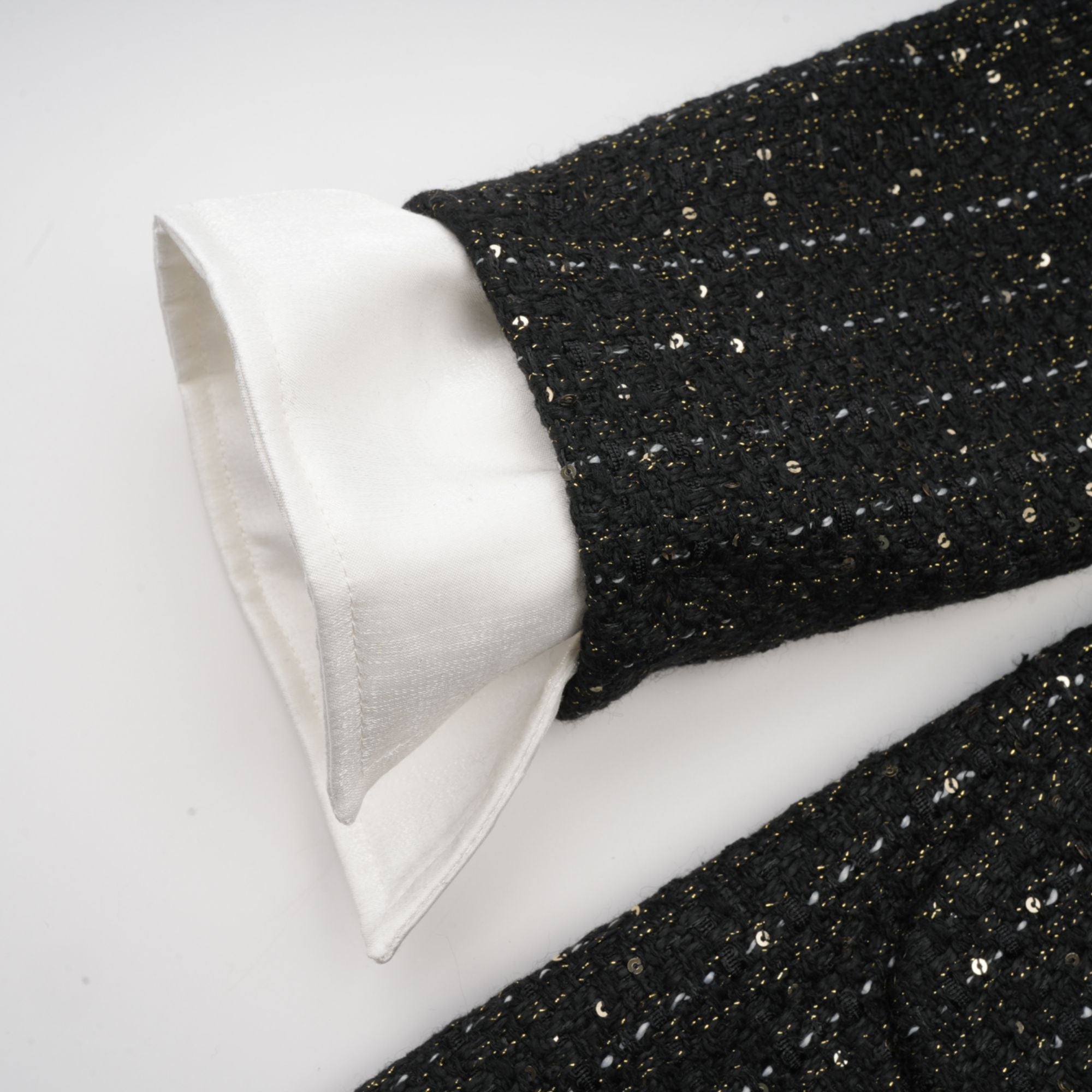 Audrey svart tweed miniklänning med paljettpaneler